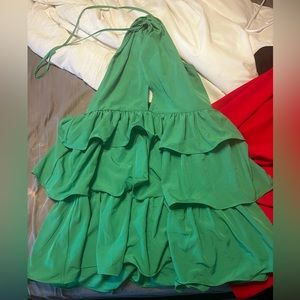 Never worn, Green halter dress that ties around the neck ruffled on the bottom